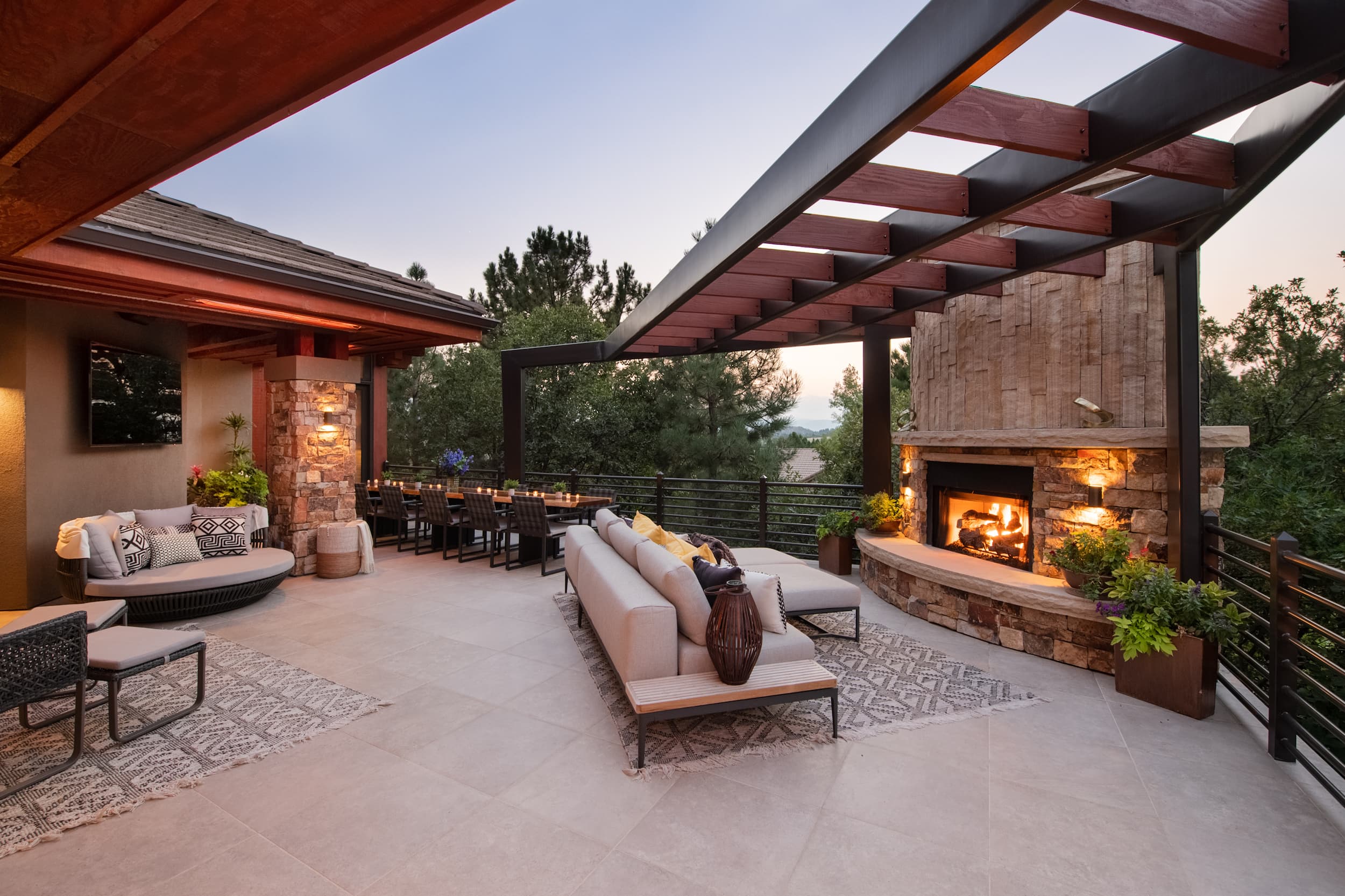 An outdoor living area with a fireplace and patio furniture.