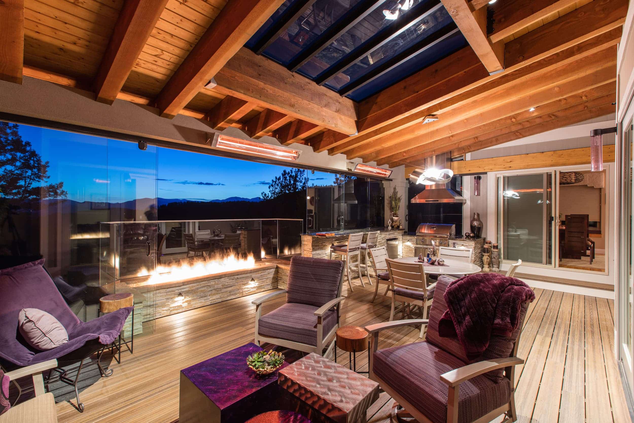 A large deck with a fire pit and patio furniture.